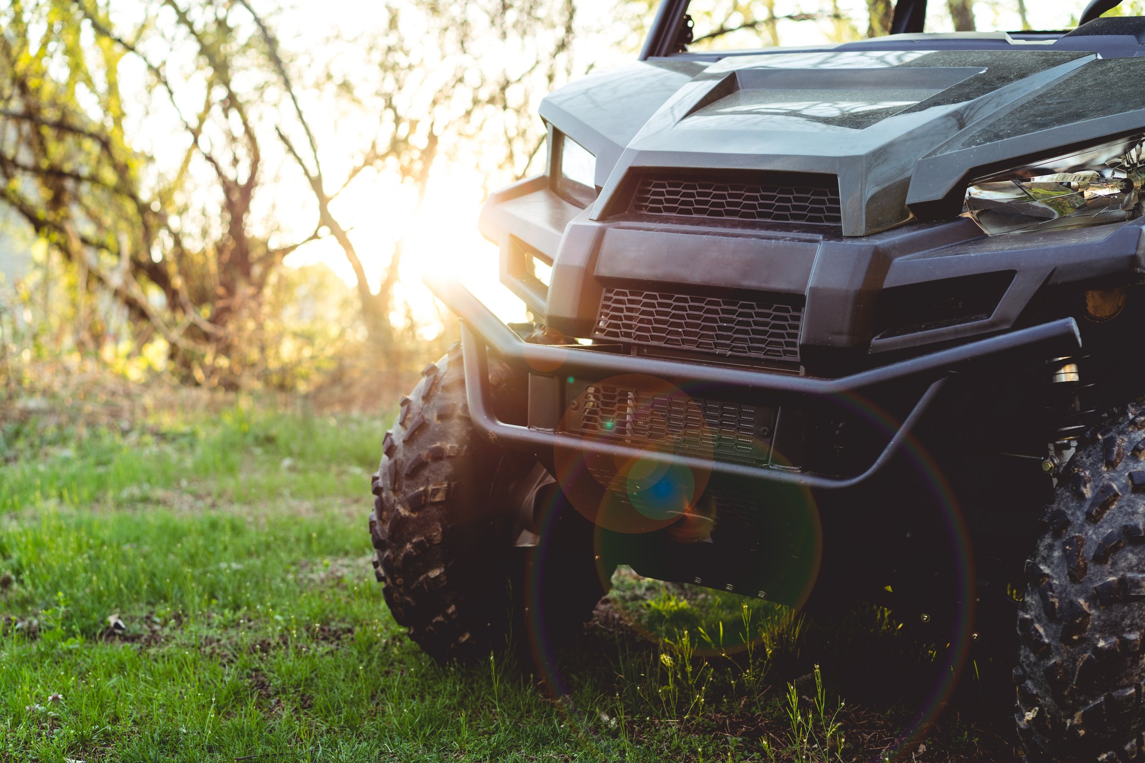 UTV or ATV 4x4 recreational vehicle at sunset